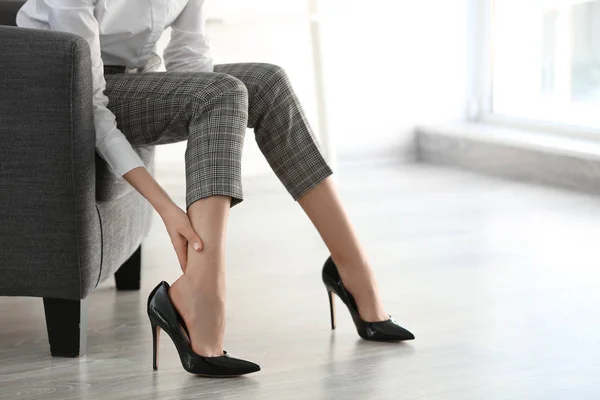 Tired Young Woman Feeling Ache Legs Indoors — Stock Photo, Image