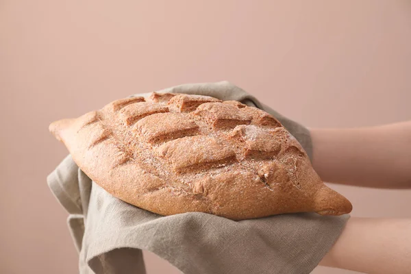 Woman Holding Fresh Tasty Bread Color Background Closeup — Stock Photo, Image