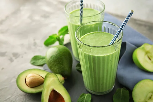 Glasses Tasty Avocado Smoothie Ingredients Grey Table — Stock Photo, Image