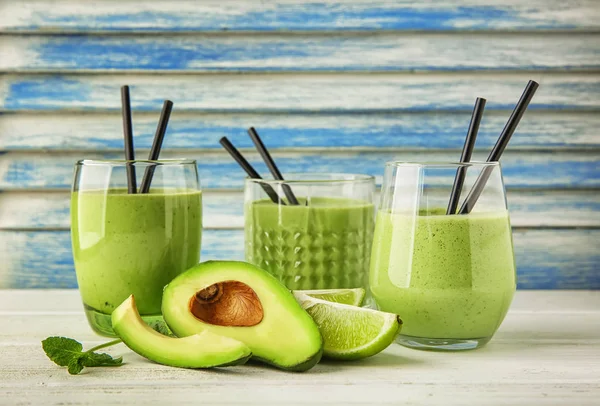 Glasses Tasty Avocado Smoothie Fresh Fruits Wooden Table — Stock Photo, Image