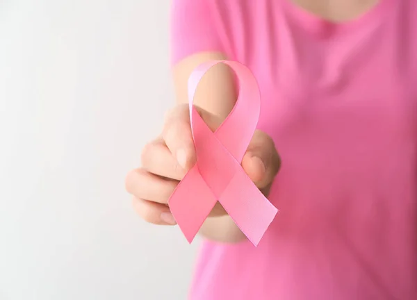 Woman Holding Pink Ribbon Light Background Closeup Breast Cancer Awareness — Stock Photo, Image