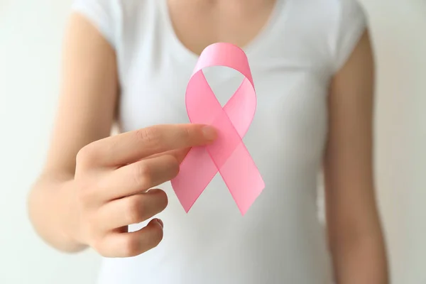 Woman Holding Pink Ribbon Light Background Closeup Breast Cancer Awareness — Stock Photo, Image