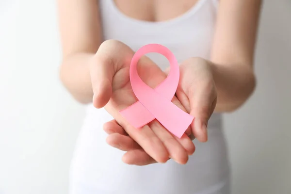 Woman Holding Pink Ribbon Light Background Closeup Breast Cancer Awareness — Stock Photo, Image