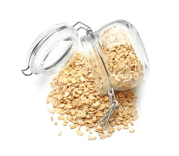 Overturned Glass Jar Raw Oatmeal White Background — Stock Photo, Image