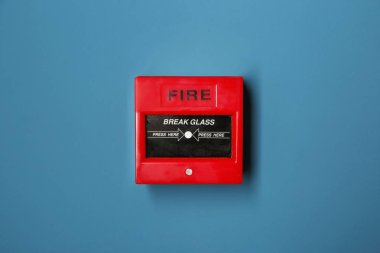 Modern fire call point on color background clipart