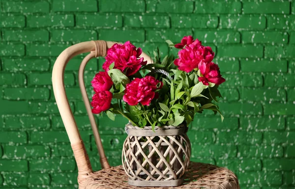 Vase Beautiful Peony Flowers Wicker Chair Color Brick Wall — Stock Photo, Image