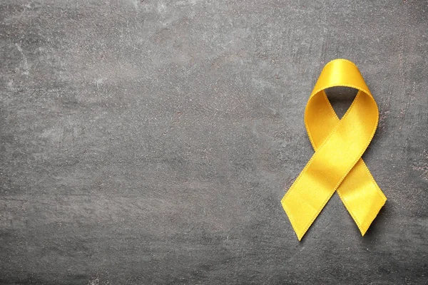 Yellow Ribbon Grey Background Cancer Concept — Stock Photo, Image