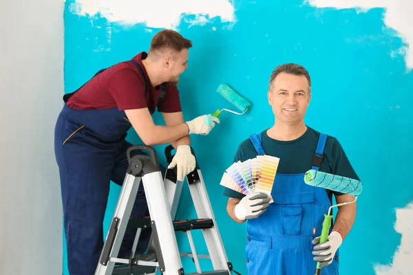 Male Painter Uniform Color Palette Samples Roller Brush Indoors — Stock Photo, Image