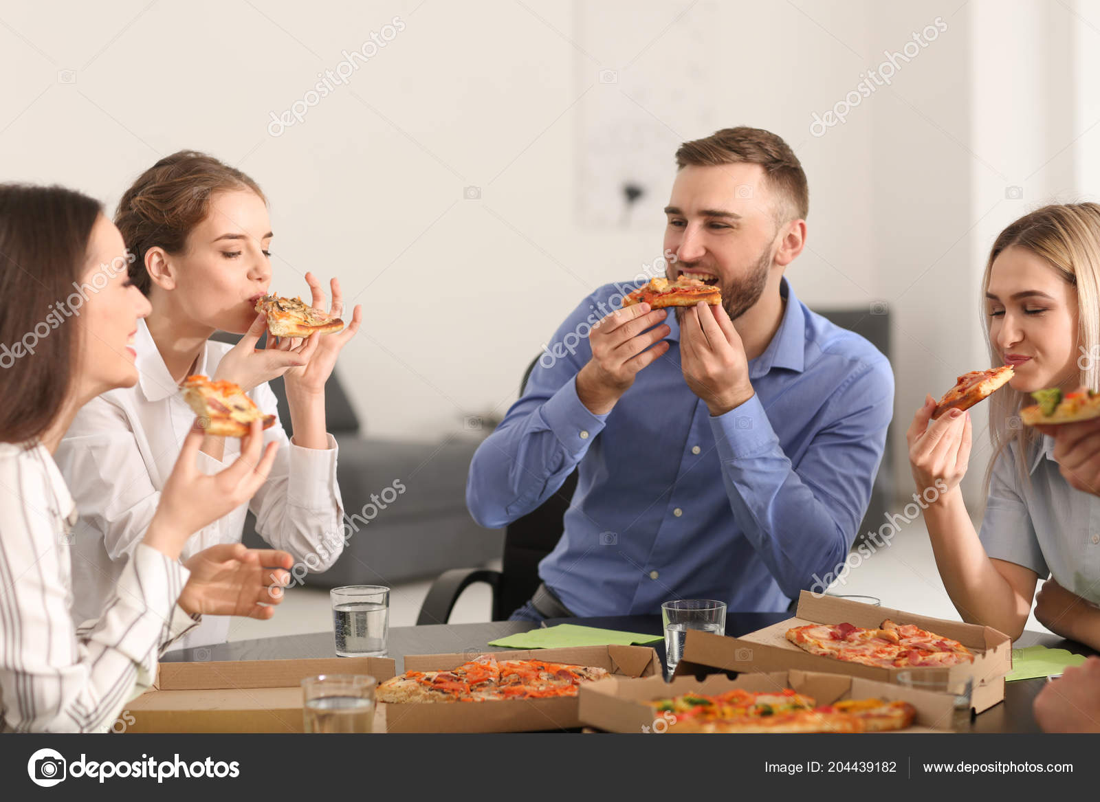Young People Eating Pizza Table Office Stock Photo C Serezniy