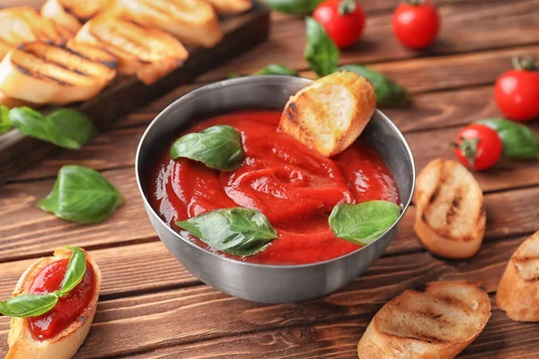 Bowl Tasty Tomato Sauce Grilled Bread Wooden Table — Stock Photo, Image