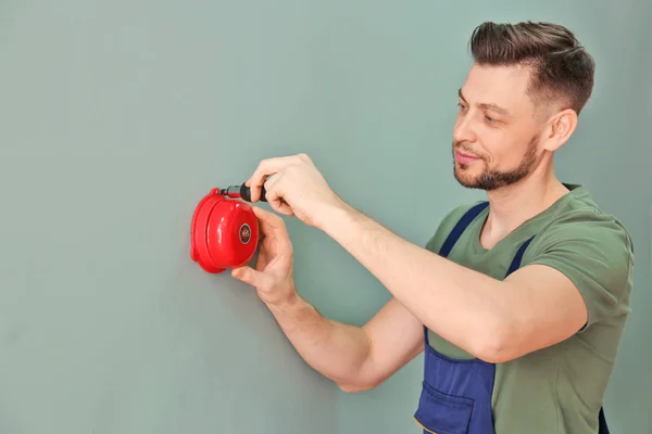Electrician Installing Alarm Bell — Stock Photo, Image