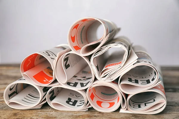 Rolled Newspapers Wooden Table — Stock Photo, Image