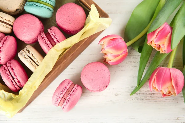 Crate Tasty Macarons Tulips Wooden Background Top View — Stock Photo, Image