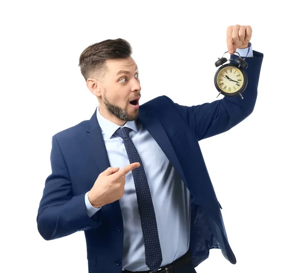 ホワイトを背景に目覚まし時計を持つビジネスマン 時間管理の考え方 — ストック写真