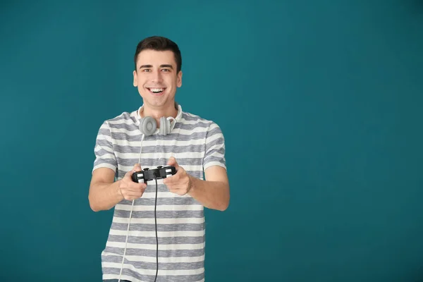 Young Man Gamepad Color Background — Stock Photo, Image