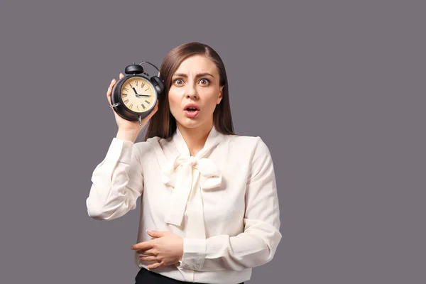 Troubled Woman Alarm Clock Grey Background Time Management Concept — Stock Photo, Image