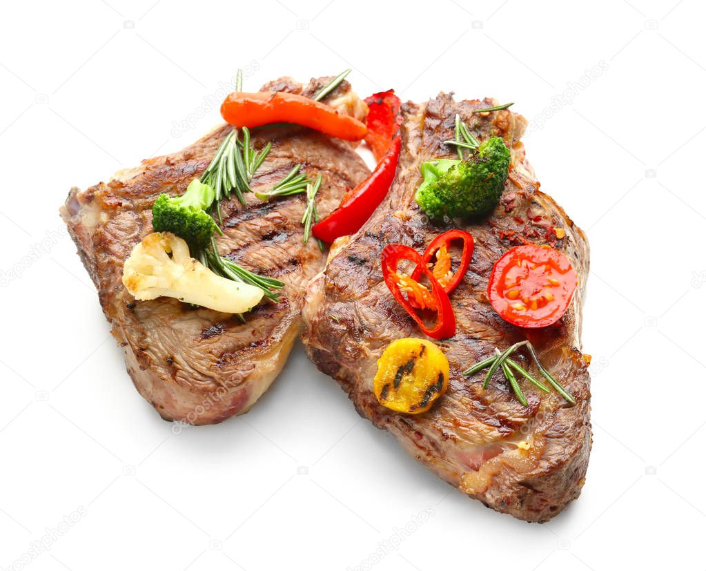 Grilled meat with vegetable garnish on white background