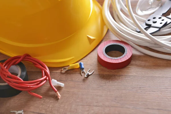 Different Electrician Supplies Hard Hat Table — Stock Photo, Image