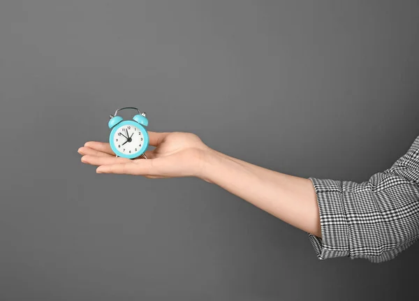 Woman Holding Alarm Clock Grey Background Time Management Concept — Stock Photo, Image
