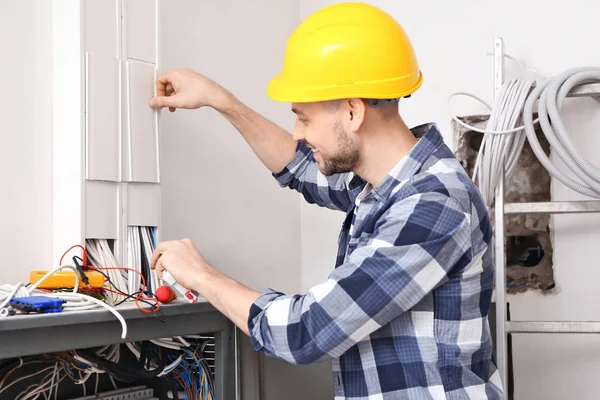 Electrician Repairing Distribution Board Indoors — Stock Photo, Image