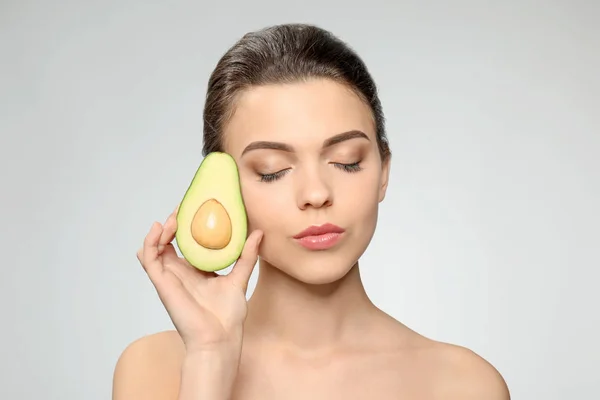 Beautiful Young Woman Avocado Light Background — Stock Photo, Image