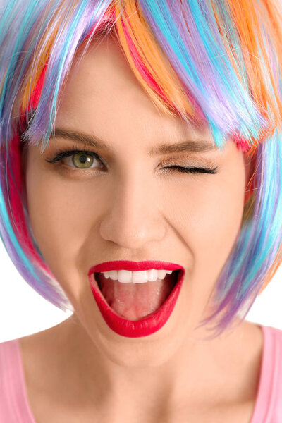 Emotional young woman with colorful hair, closeup