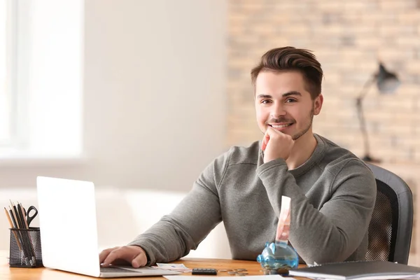 Young Man Counting Money Table Indoors — Stock Photo, Image