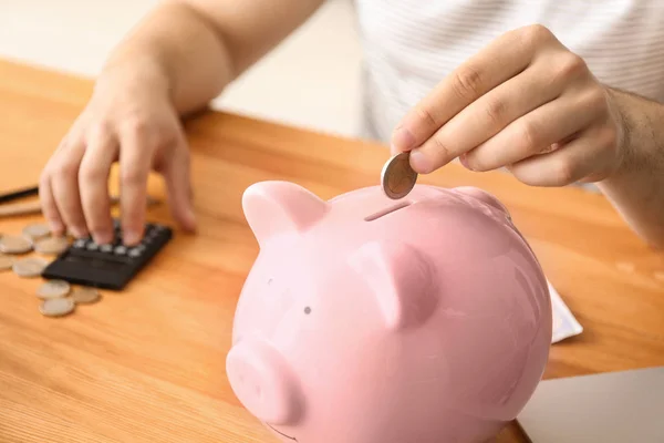 Man Putting Coin Piggy Bank Closeup Money Savings Concept — Stock Photo, Image