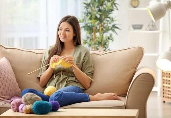 Young Woman Sitting Sofa Knitting Warm Sweater Indoors — Stock Photo, Image