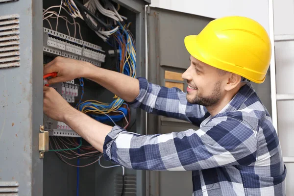 Electrician Repairing Distribution Board Stock Picture