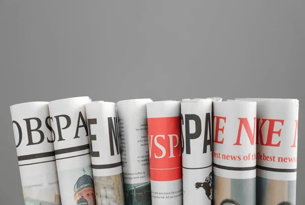 Folded Newspapers Grey Background — Stock Photo, Image