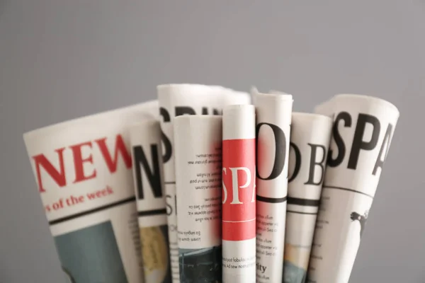 Newspapers Grey Background — Stock Photo, Image