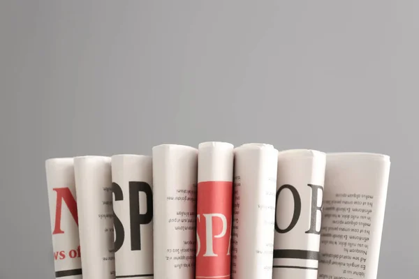 Various Newspapers Grey Background — Stock Photo, Image