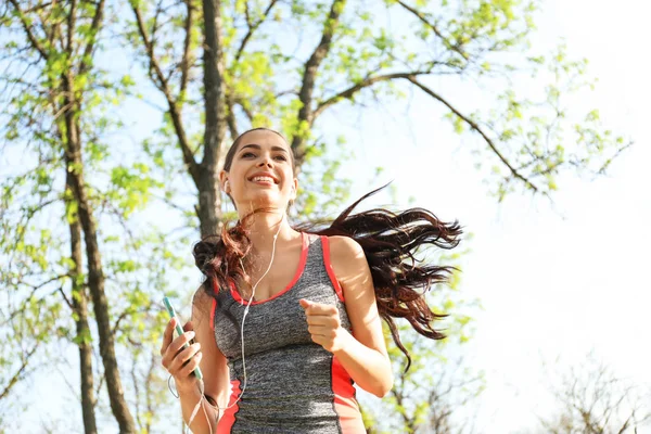 Sporty Young Woman Listening Music While Running Park — Stock Photo, Image