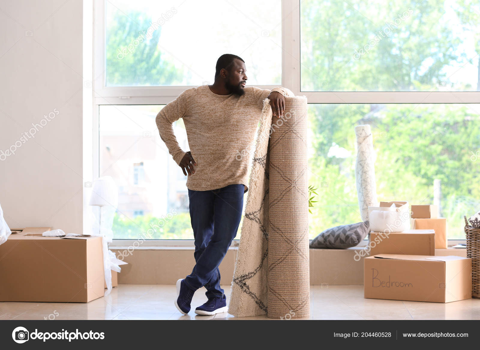 African American Man Carpet Boxes Indoors Moving New House Stock Photo