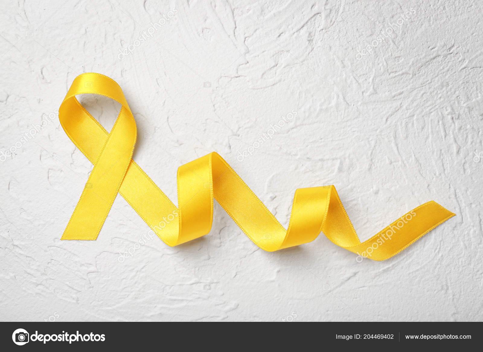 Yellow Ribbon Light Background Cancer Concept Stock Photo by ©serezniy