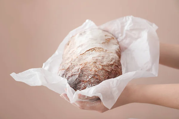 Woman Holding Fresh Tasty Bread Color Background Closeup — Stock Photo, Image