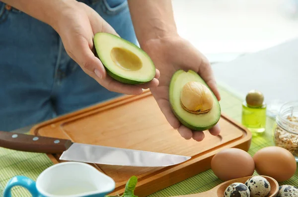 Young Woman Making Nourishing Mask Avocado Table — Stock Photo, Image