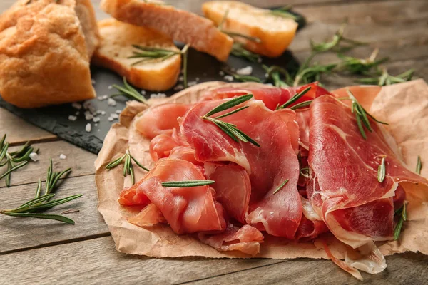 Sliced Prosciutto Rosemary Wooden Table — Stock Photo, Image