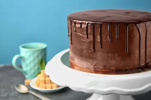 Stand Delicious Chocolate Cake Table Color Background — Stock Photo, Image