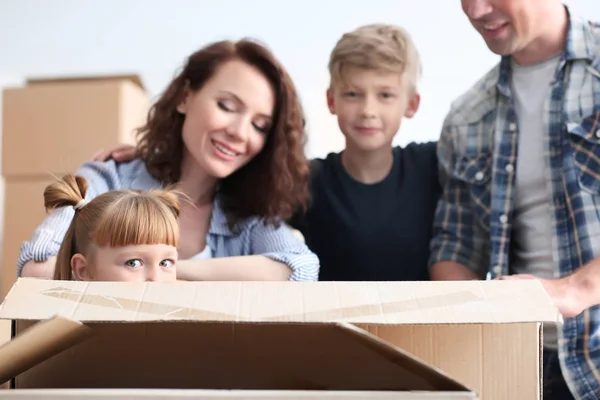 Cute Girl Cardboard Box Her Family Indoors Moving New House — Stock Photo, Image