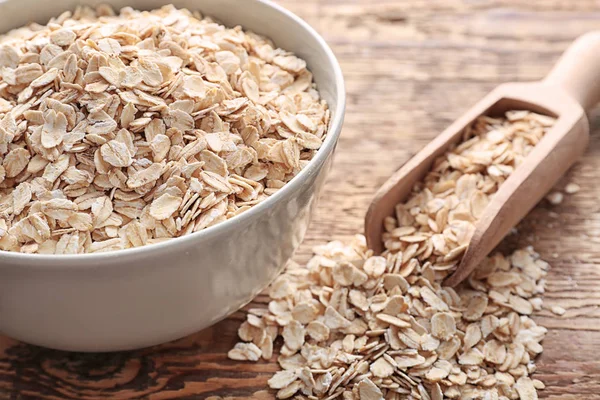 Bowl Raw Oatmeal Flakes Wooden Table — Stock Photo, Image