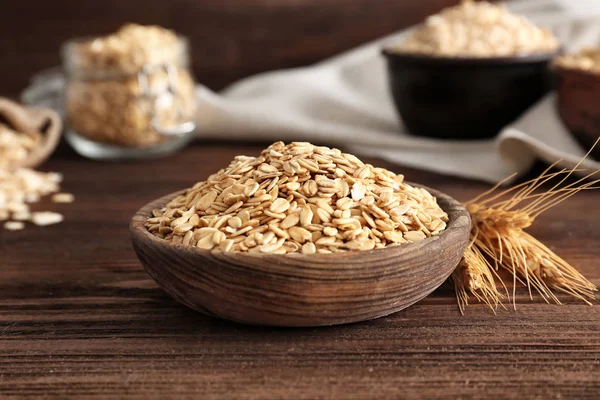 Bowl Raw Oatmeal Flakes Wooden Table — Stock Photo, Image