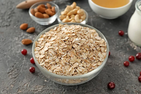 Bowl Oatmeal Flakes Textured Background — Stock Photo, Image