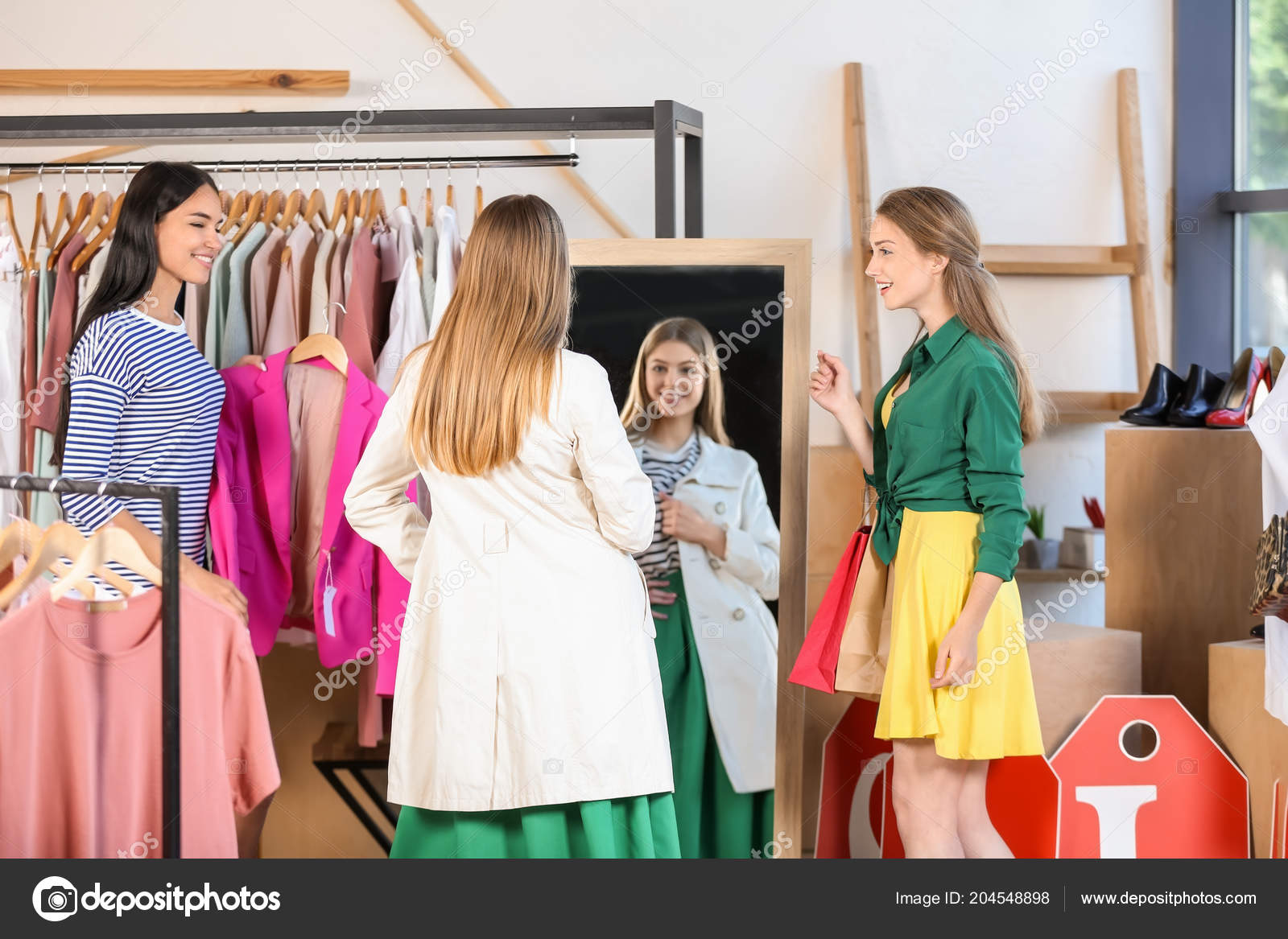Young Beautiful Women Choosing Clothes Modern Shop — Stock Photo
