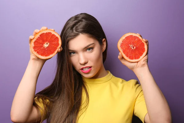 Beautiful Young Woman Halves Grapefruit Color Background — Stock Photo, Image