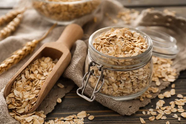 Tarro Vidrio Cuchara Con Avena Cruda Sobre Fondo Madera — Foto de Stock