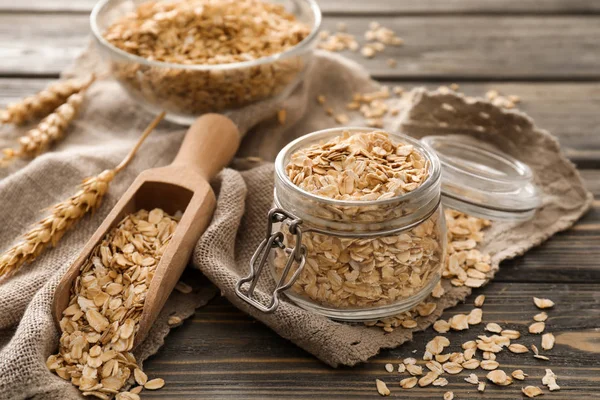 Glass Jar Scoop Raw Oatmeal Wooden Background — Stock Photo, Image