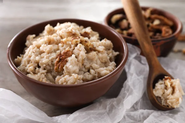 Bowl Tasty Oatmeal Walnuts Table — Stock Photo, Image