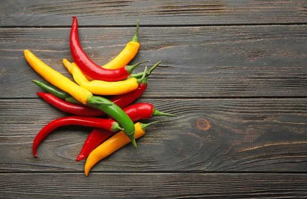 Different Fresh Chili Peppers Wooden Background — Stock Photo, Image